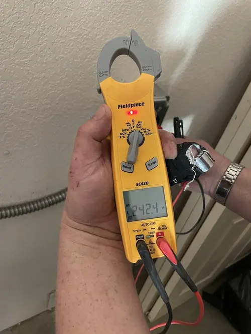 Voltage testing with clamp meter during Whole House Surge Protector in Cottrellville